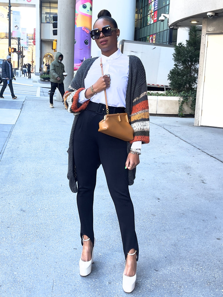 Monica in knitted cardigan and Valentino platforms